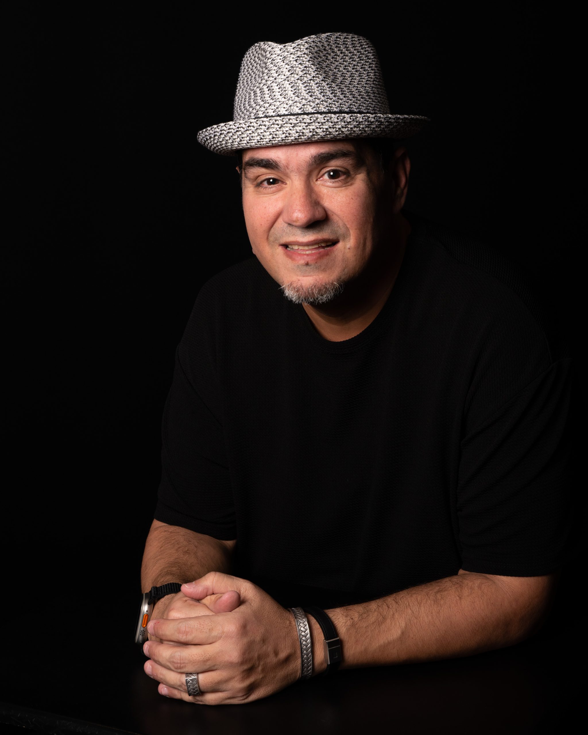 Chris Lema wearing a hat against a dark background