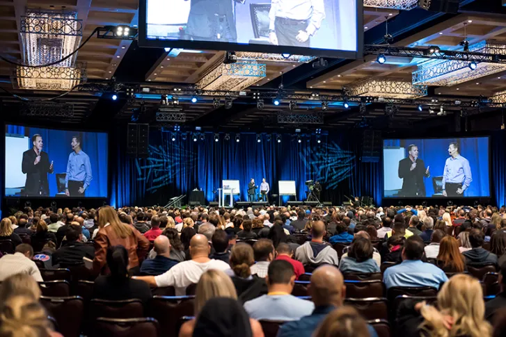Mitch Jackson on stage at Tony Robbins Business Mastery